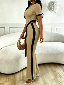 Side view of ribbed khaki two-piece set with black contrast trim and flared pants.