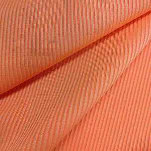 Macro detail of the high-quality orange ribbed knit fabric for women's bodysuits