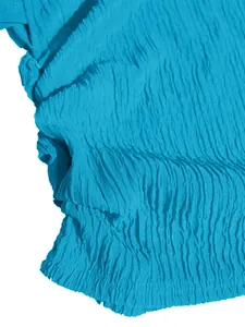 Detailed close-up showing the blue crinkle textured fabric of this elegant vacation style set
