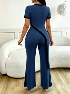 Back view of stylish navy blue asymmetrical cutout crop top and wide leg pants set