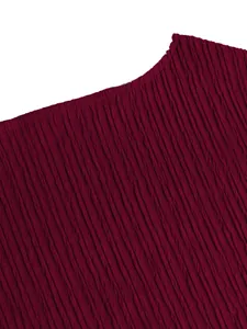 Detail shot of the premium burgundy crinkle textured fabric for elegant vacation set