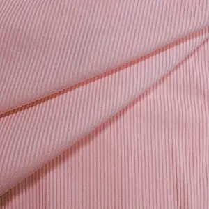 Close-up detail of high-quality soft pink ribbed knit fabric texture for fashion bodysuits