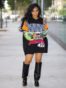 Outdoor street view of oversized color-block hooded T-shirt dress with letter prints