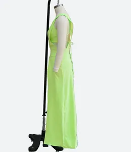 Side view of a neon lime green 2-piece set featuring a cropped top and a long skirt