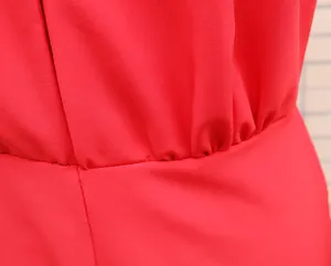 Close-up of red romper high waist elastic gathering and breathable fabric texture details.