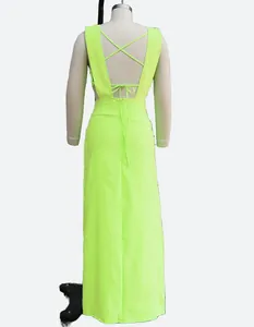 Back view of neon lime green two-piece maxi dress set with criss-cross straps