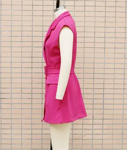 Side view of a pink sleeveless blazer dress with belt for office commuter wear