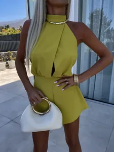 Close-up of lime green halter neck sleeveless romper with front cut-out detail