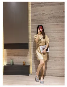 Model wearing silver rhinestone square toe Mary Jane shoes with a block heel.