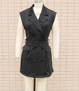 Front view detail of a black double-breasted sleeveless blazer dress with matching belt