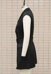 Side view detail of a black sleeveless blazer dress with a belted waist for office wear.