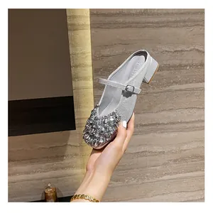 Silver Mary Jane style block heel mule with square toe and sparkling rhinestone clusters
