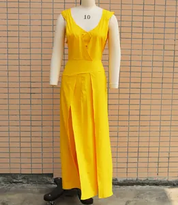 Close-up detail of a bright yellow two-piece dress set featuring a deep V-neck vest and inner