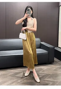 Elegant leather French-style ballet flats with bow detail worn by a model in a studio.