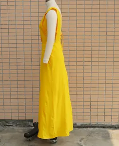 Side view profile of vibrant yellow two-piece dress set on professional mannequin