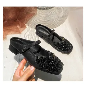 Detail showing the luxurious black rhinestone embellishments on square toe Mary Jane mules