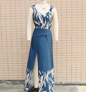 Full view of navy leaf print two-piece maxi dress set displayed on a mannequin torso
