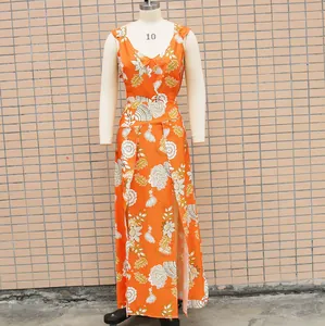 Close-up detail of a vibrant orange floral two-piece maxi dress set on mannequin