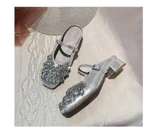 Silver Mary Jane block heel mules with sparkling rhinestone embellishments and square toe
