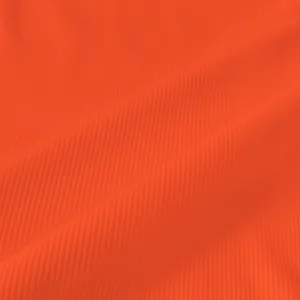 Close-up of bright orange ribbed fabric texture showing detailed vertical knit patterns