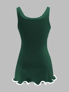 Back view of a dark green sleeveless rib-knit tank dress with wavy lettuce edge hem