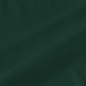 Macro shot of dark green ribbed knit fabric showing fine vertical texture and soft folds.