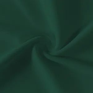 Macro detail of dark green ribbed stretch fabric texture for slim fit tank dress.