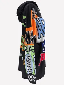 Detailed side profile of an oversized black hoodie dress with pixelated letter prints