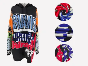 Detailed view of oversized hoodie dress with vibrant pixelated letter print and fabric texture