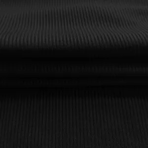 Macro view showing the high-quality black ribbed texture of this stylish bodysuit fabric.