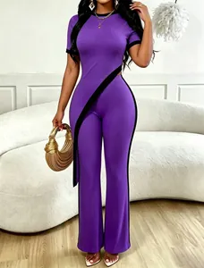 Chic two-piece purple ribbed set featuring an asymmetric cropped top and wide-leg pants