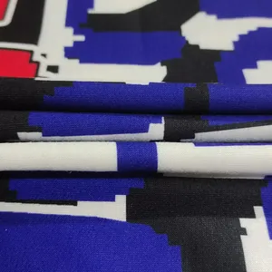 Detailed macro shot showing the pixelated colorblock pattern and knit texture of hoodie dress