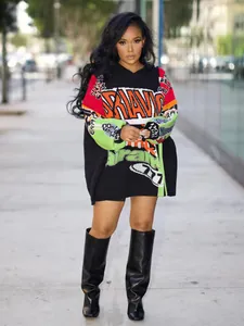 Full length shot of the stylish oversized graphic print hoodie dress with vibrant colors