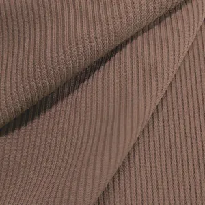 Macro view of the premium ribbed fabric texture of this mauve fashion jumpsuit jumpsuit.