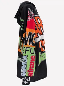 Detailed side view of a loose black hoodie dress featuring vibrant pixelated letter prints