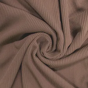 Close-up of the brown ribbed knit fabric texture for the sexy backless jumpsuit
