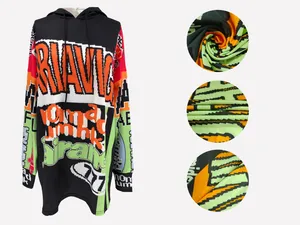 Detailed view of the vibrant pixelated letter print on the soft color-block hooded dress fabric