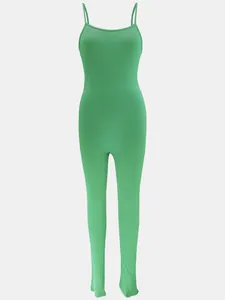 Close-up showing the green ribbed fabric texture of a slim-fit spaghetti strap jumpsuit.