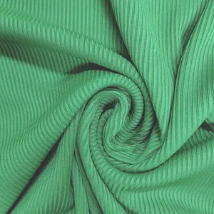 Detailed close-up view of the vibrant green ribbed fabric texture for women's sexy jumpsuit.