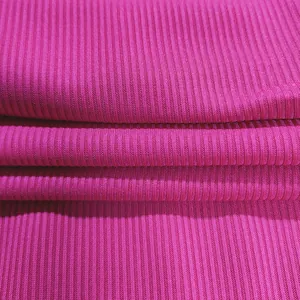Detailed macro texture of hot pink ribbed fabric for a stylish women's slim jumpsuit