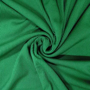 Detailed macro shot of the emerald green ribbed fabric texture for a sexy jumpsuit
