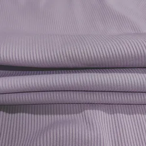 Close-up macro view of soft lavender ribbed knit fabric used for sexy camisole bodysuits