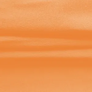 Nahaufnahme der Textur des leuchtend orangen Stoffes für modische Sommer-Jumpsuits