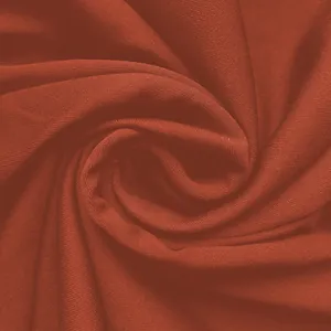 Nahaufnahme der detaillierten Textur des rotbraunen, weichen Strickstoffs Material