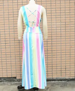Back view of rainbow striped maxi dress with criss-cross tie detailing on a mannequin