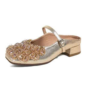 Elegant gold Mary Jane mules with square toe and sparkling rhinestone accents