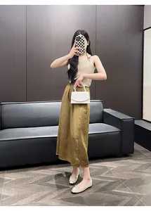 Elegant French retro gold flats with bow detail worn by model in stylish setting