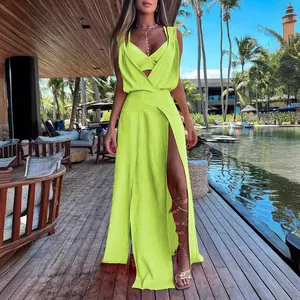 Lime green two-piece resort wear set featuring a crop top and high slit maxi skirt