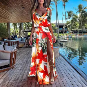 Vibrant tropical print two-piece set featuring a crop top and high-slit maxi skirt.