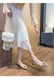 Elegant champagne gold glitter flat shoes with floral accent for weddings or parties